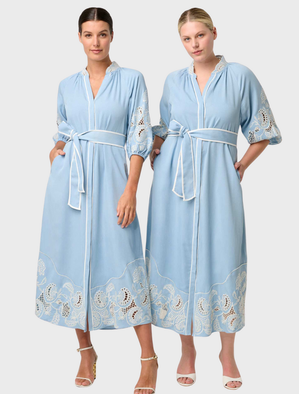 Two women wearing blue embroidered maxi dresses, showcasing the Amara Tencel design in Blue Haze.