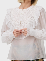 Antique Thea Blouse with floral lace bib yoke and ruffle trim, made from silk cotton blend for a romantic, vintage-inspired look.