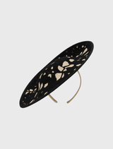Timeless black fascinator with lace-like floral accents on a headband, designed for effortless styling at formal occasions.