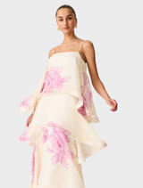 Cream and pink floral Rova tiered gown displayed on a mannequin, showcasing its elegant design and layered structure.