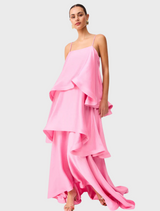 The pink dress, made from silk chiffon, displays a lightweight and airy design, perfect for elegant occasions.