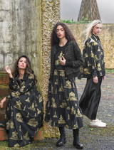 Trendy black and gold skirt with a fun design, ideal for elevating everyday outfits or special event attire.