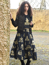 Black and gold skirt with a playful design, featuring a whimsical pattern that adds a touch of fun to any outfit.