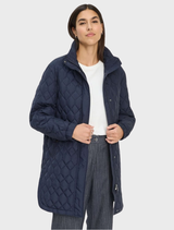Navy Tokio Jacket displayed on a hanger, showcasing its sleek design and modern style.
