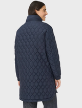 A navy Tokio Jacket hanging, highlighting its contemporary cut and fabric texture.