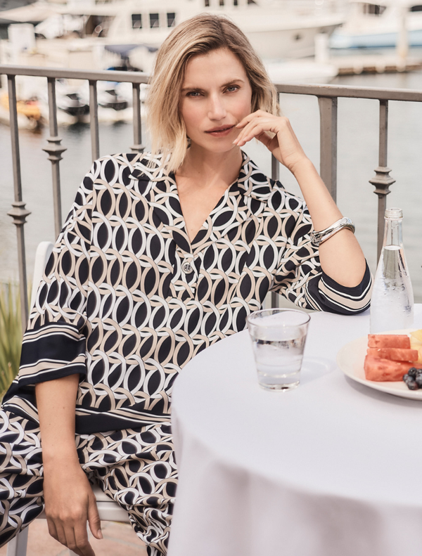 Top in midnight blue with multi-colored accents, featuring a stylish design suitable for various occasions.