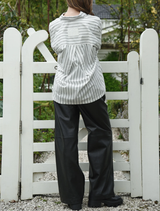 Black Track-Tic Pant draped on a mannequin, emphasizing its stylish fit and versatility for various occasions.