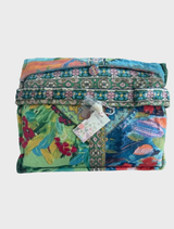 Travel blanket styled as a Torenia scarf, featuring a floral pattern in soft, cozy fabric for warmth and comfort.