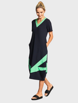 Black and green dress showcasing a deep v-neck cut.