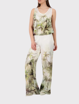 Stylish olive top with an all-over tropical print, satin finish, round neckline, tank sleeves, and elastic hem for summer wear.