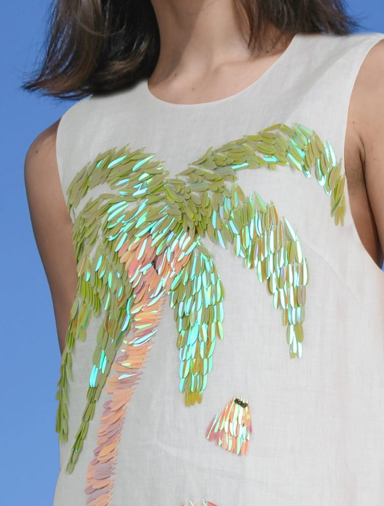 Chic white Trump Card Dress showcasing a modern cut, suitable for upscale occasions and fashionable outings.