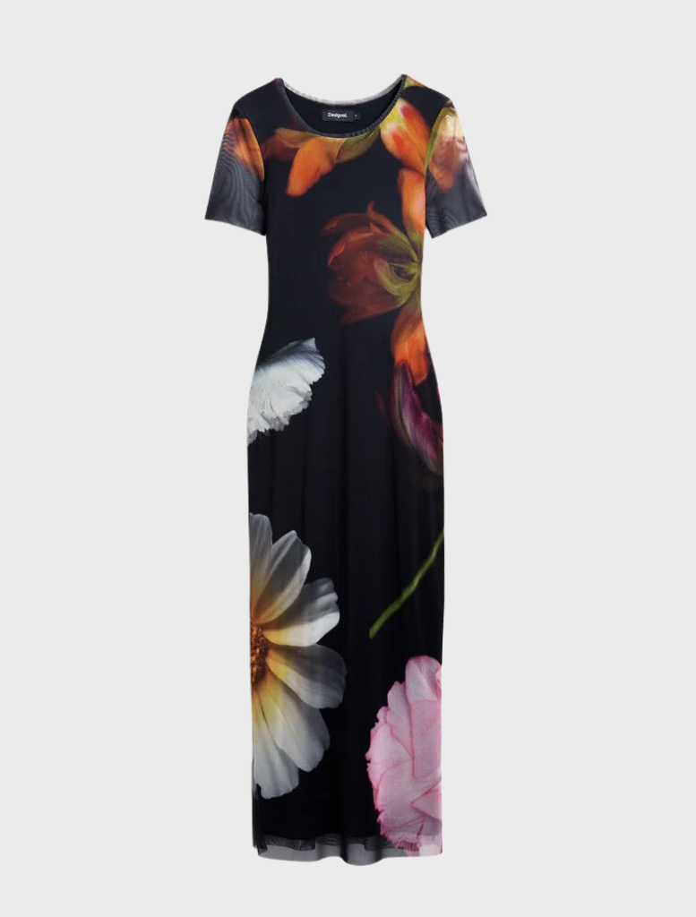 A black dress showcasing a beautiful floral design, offering a striking contrast between dark and colorful elements.
