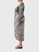 Trendy twist front dress featuring an Istanbul Animalia print, emphasizing bright colors and a contemporary style