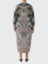 Trendy twist front dress featuring an Istanbul Animalia print, emphasizing bright colors and a contemporary style.


