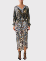 A twist front dress featuring an Istanbul Animalia print, showcasing vibrant colors and a stylish design.