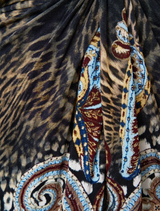 Elegant twist front dress with a unique Istanbul Animalia design, combining vibrant hues and modern aesthetics.