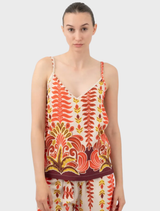 Orange Tylis top displayed on a hanger, showcasing its vibrant color and stylish design.