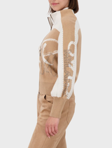 Cognac patterned cardigan jacket displayed on a hanger, showcasing its textured fabric and stylish design.