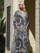 Blue Up Front Dress featuring cut-out sleeves, adjustable drawstrings, and a flattering V-neckline with collar detail.