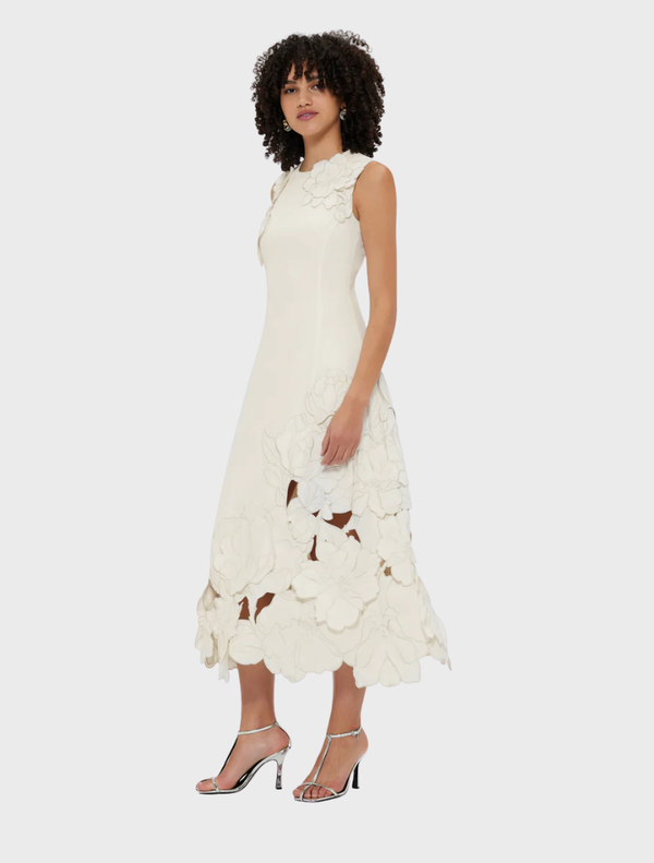 Elegant vanilla midi dress featuring a sleeveless design and decorative appliqué, ideal for summer events.