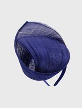 Vibrant cobalt blue fascinator with a twisting ribbon design, mounted on a simple headband for elegant race day attire.