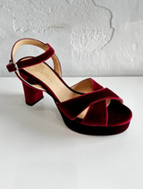 Close-up of bordo velvet, highlighting its soft texture and elegant, deep red color.