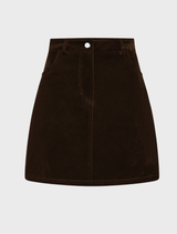  Chocolate velvet mini skirt showcasing a soft texture and stylish design, perfect for casual or dressy occasions.