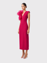 V-neck maxi dress in raspberry pink with sculptural floral details, fitted silhouette, and centre-back split for ease of movement.
