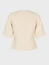 Elegant white blazer with short sleeves, round neckline, and button closure, suitable for versatile styling as a top.
