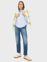 Vica's blue striped shirt, showcasing a stylish pattern ideal for versatile wardrobe options.