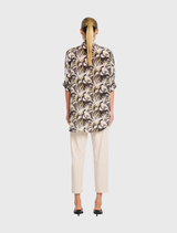 Villa Overshirt in Bayleaf, made of mid-weight silk, features a relaxed fit, stand collar, and short dolman sleeves.