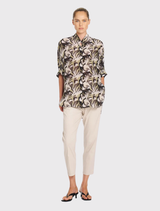 Relaxed-fit Villa Overshirt in Bayleaf, crafted from soft silk crepe, featuring a stand collar and short dolman sleeves.
