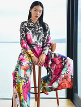 Wide-leg trousers in SCATTERED DAISIES satin, featuring side splits, elastic back, and pockets for a chic, comfortable look.