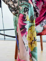 Elegant wide-leg trousers in scattered daisies print, designed with side splits, elastic back, and practical side pockets.