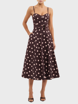 Elegant Vivianne Strap Midi Dress adorned with a playful polka dot design, ideal for summer outings or gatherings.