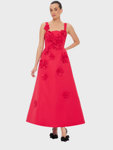  Red dress with floral embroidery, showcasing vibrant flowers and intricate stitching on a flowing fabric.