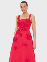 A vibrant red tulle dress, showcasing its delicate and airy fabric.