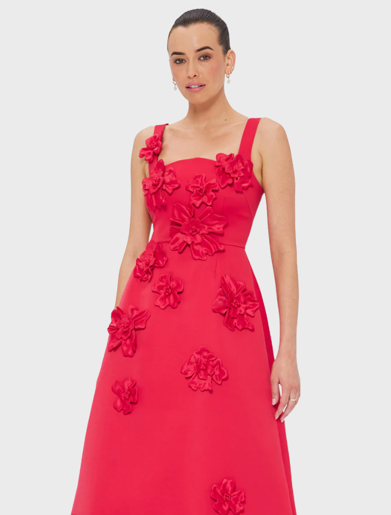 A vibrant red tulle dress, showcasing its delicate and airy fabric.