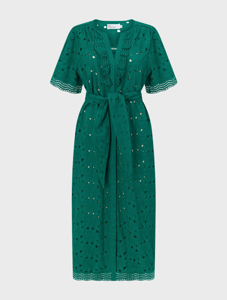Beautiful emerald green Voyage Dress, designed with a chic silhouette for sophisticated evening wear.