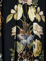  Ottoman-style dress featuring a shaped waistband and gathered sleeves, combining elegance with contemporary fashion.