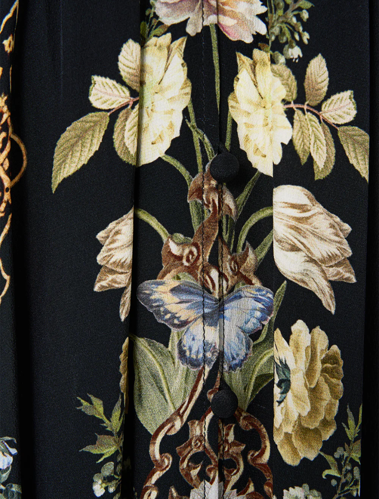  Ottoman-style dress featuring a shaped waistband and gathered sleeves, combining elegance with contemporary fashion.