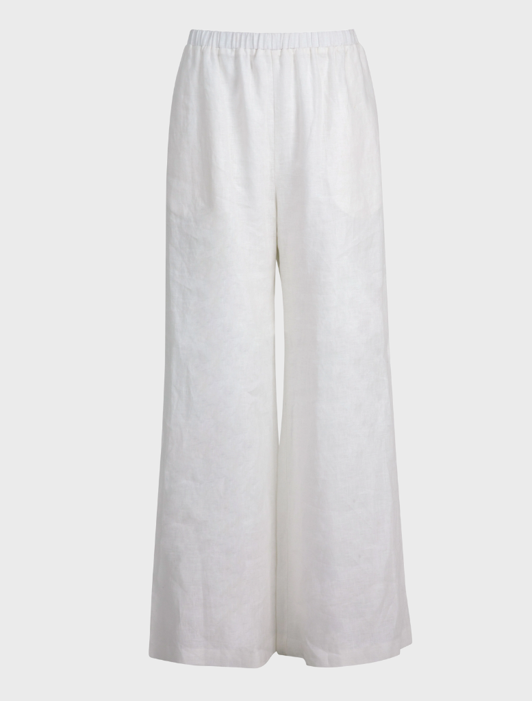 Close-up of white Walk And Talk Trousers, emphasizing the fabric texture and tailored cut for a polished appearance.