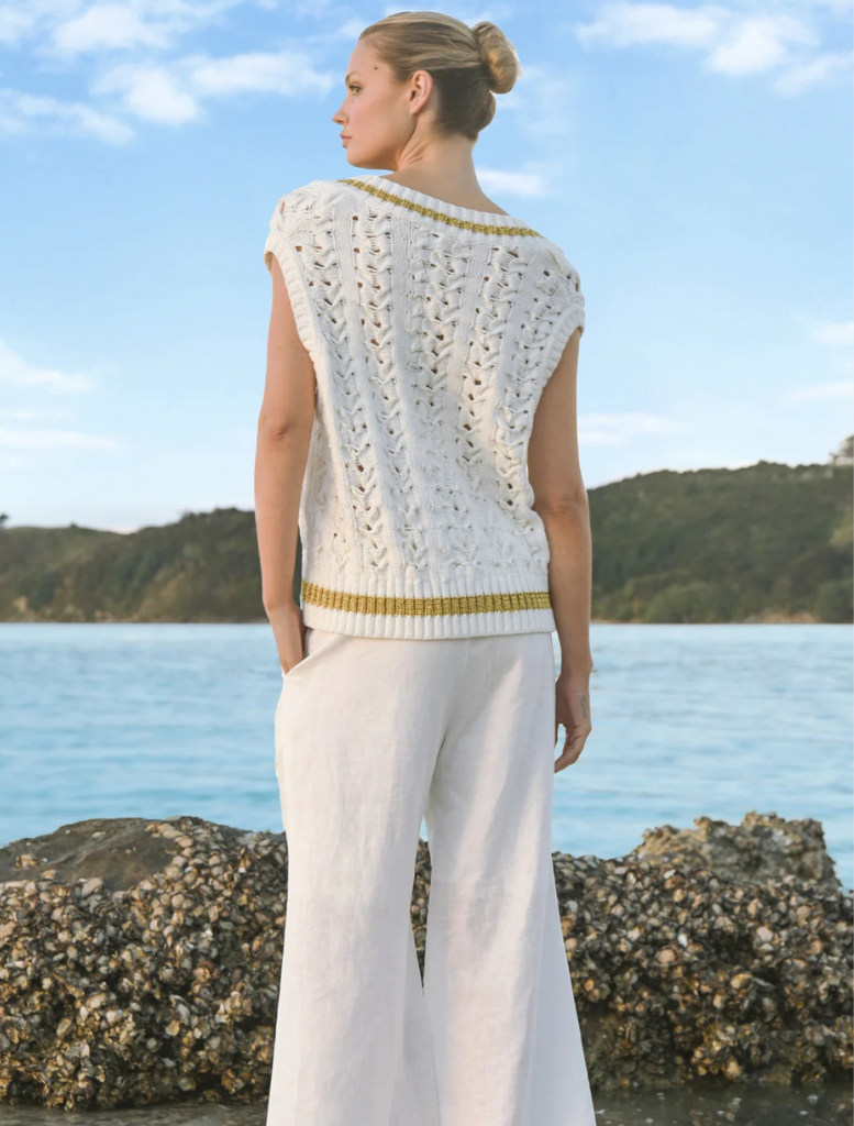 White Walk And Talk Trousers draped elegantly, highlighting their versatile design for both casual outings and professional events.