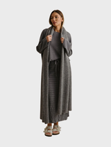Ash-colored pleat skirt crafted from Merino cotton, designed for a chic and comfortable fit in any fashion ensemble.
