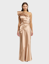 Champagne-colored Werona maxi dress displayed on a mannequin, featuring a flowing silhouette and elegant design.