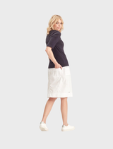 White Acrobat Legion Skirt displayed on a mannequin, showcasing its sleek design and fabric texture.