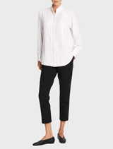 Elegant white blouse with a balcony neckline and short sleeves, ideal for casual or dressy occasions.
