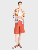 Lightweight cotton bomber jacket in white and coffee, showcasing a vibrant floral jacquard design, ideal for layering.
