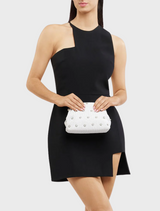 A chic white clutch bag featuring silver studs, perfect for adding elegance to any outfit.