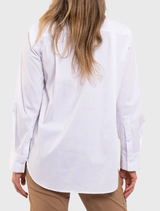 White Saville Shirt with a longline silhouette, crisp collar, and pocket detailing, designed for versatility and comfort.